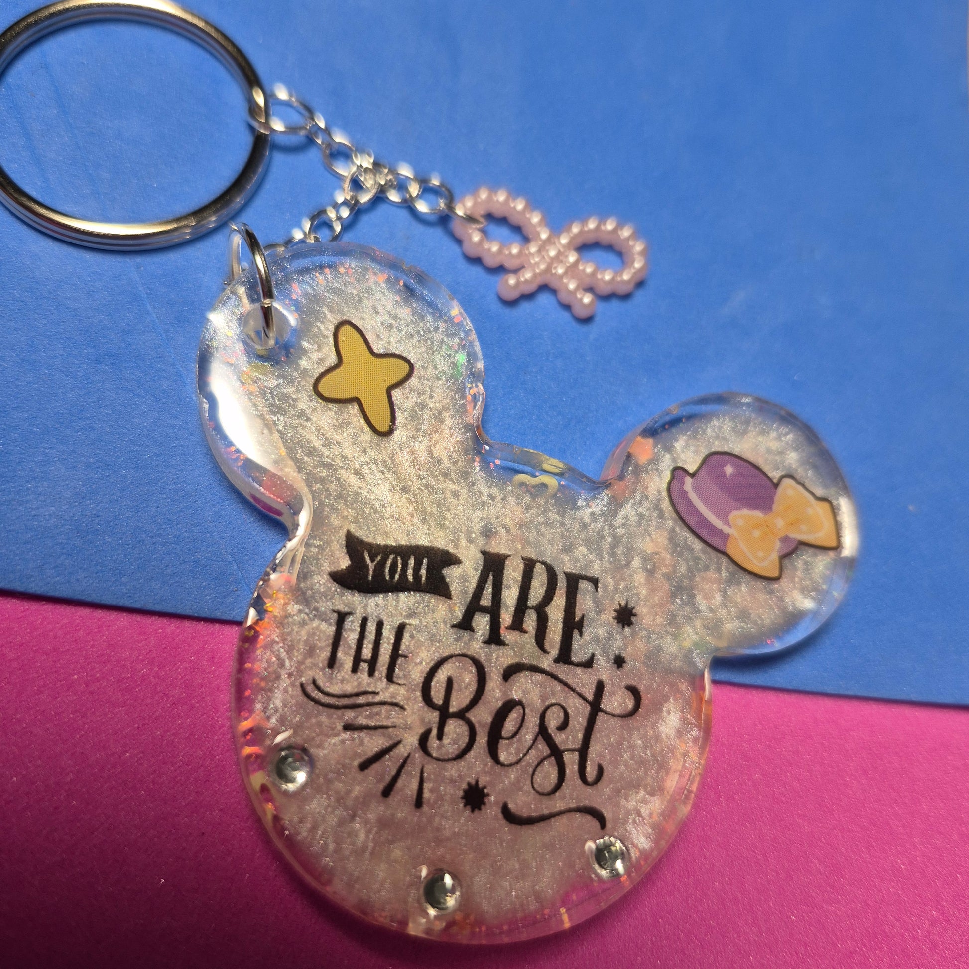 M. Mouse keychains. Message in front and hearts from behind.