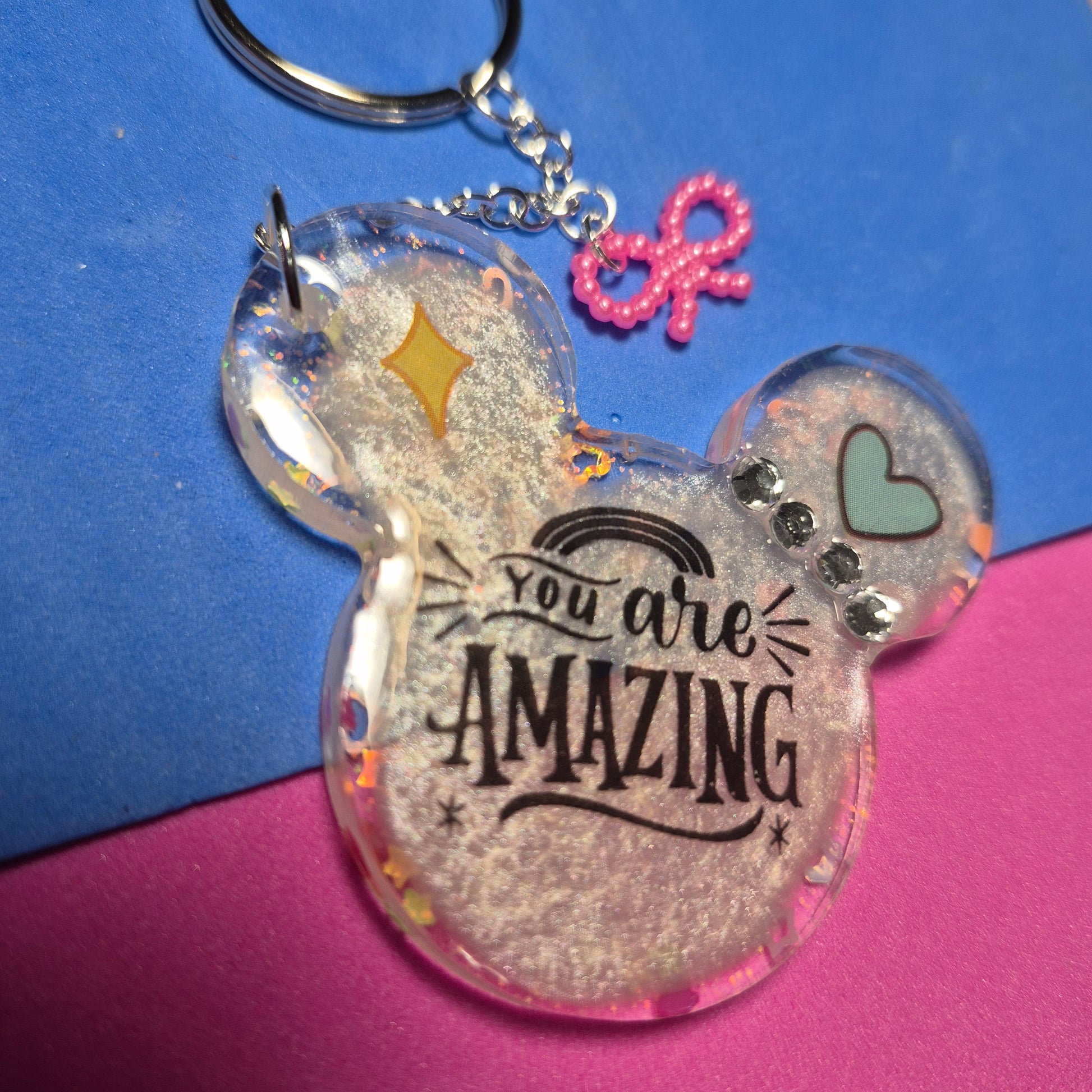 M. Mouse keychains. Message in front and hearts from behind.
