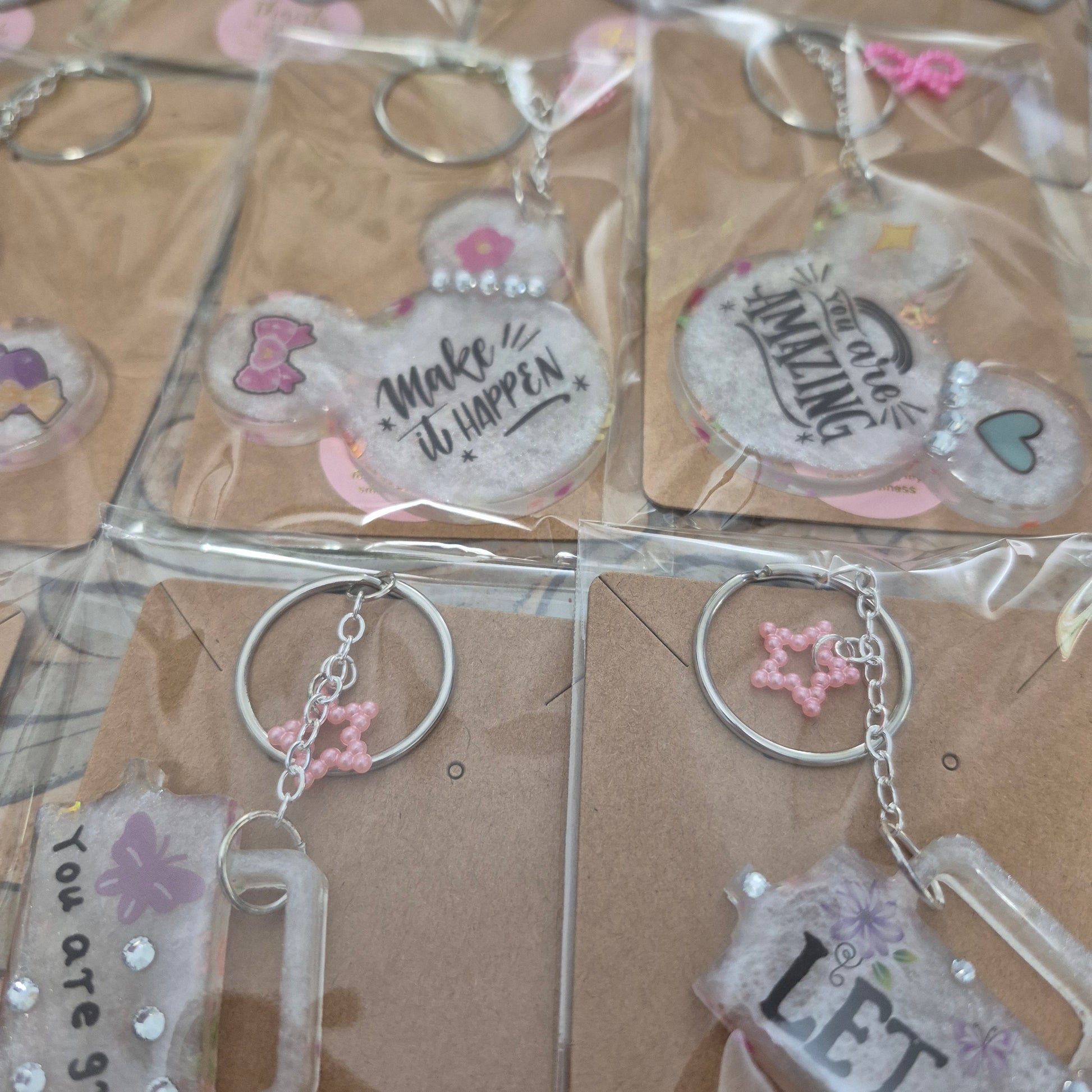 M. Mouse keychains. Message in front and hearts from behind.