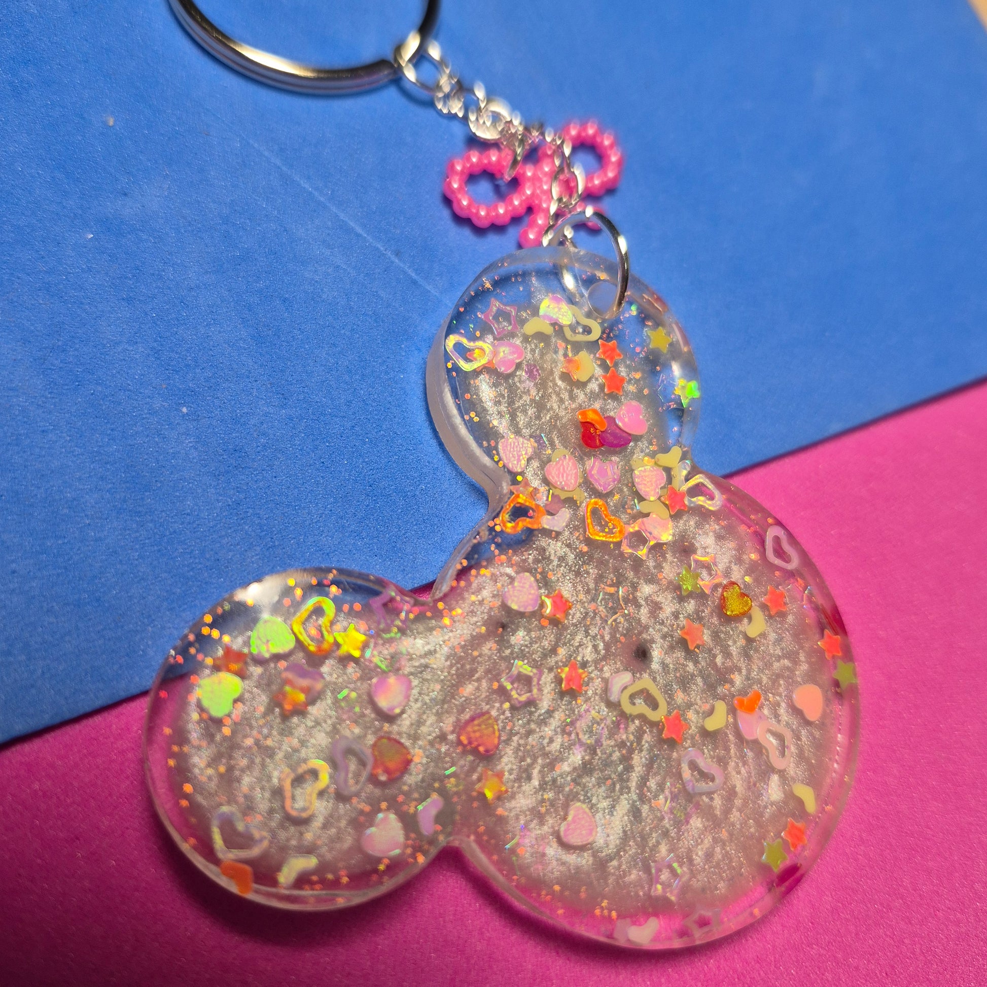 M. Mouse keychains. Message in front and hearts from behind.