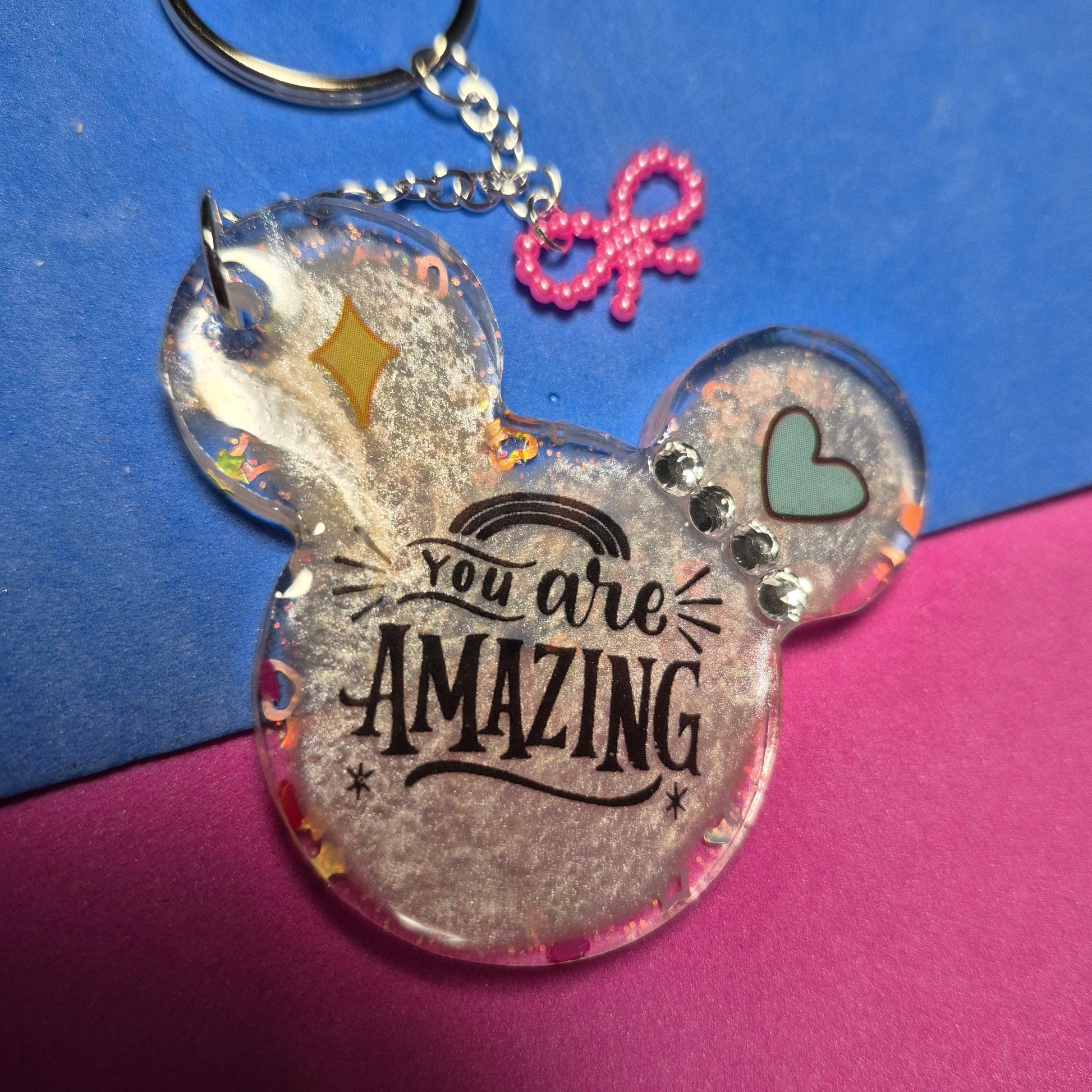 M. Mouse keychains. Message in front and hearts from behind.